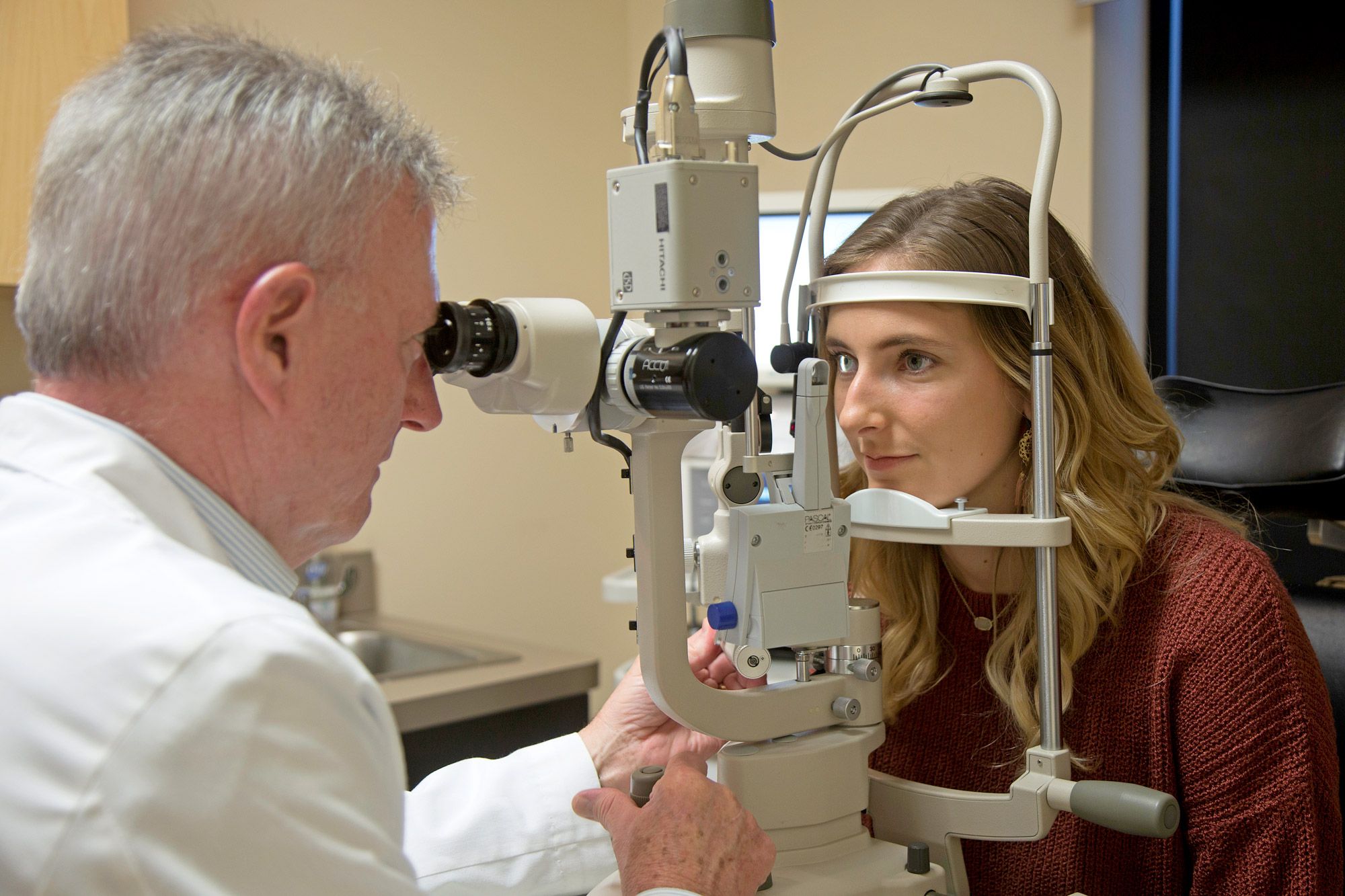 Dr. Walter Choate examining a patient's eyes